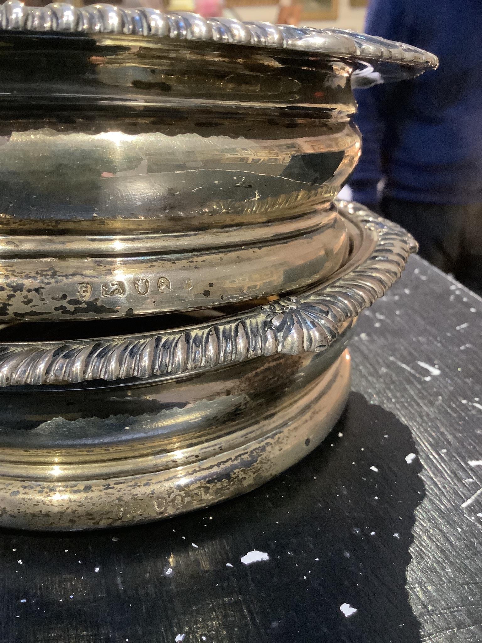 A pair of George IV silver mounted wine coasters by John Walton?